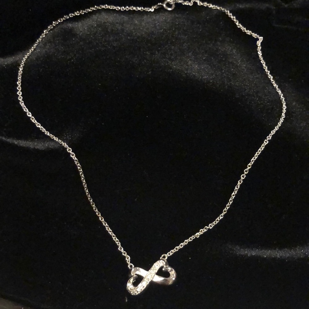 Silver tone infinity necklace
